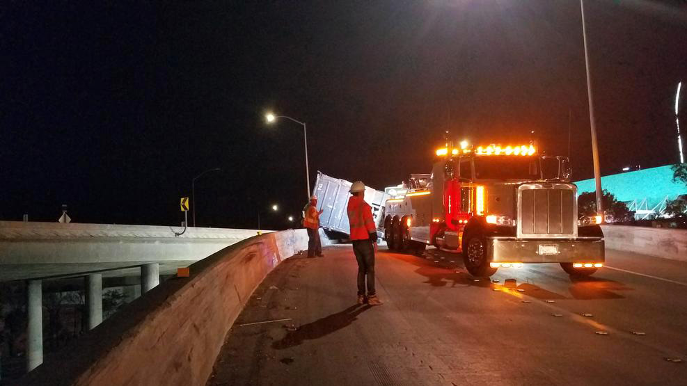 Trash Spills From Overturned Truck on Freeway Transition Near Downtown Los Angeles