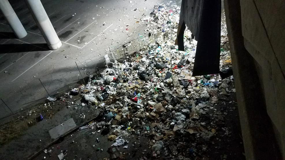 Trash Spills From Overturned Truck on Freeway Transition Near Downtown Los Angeles